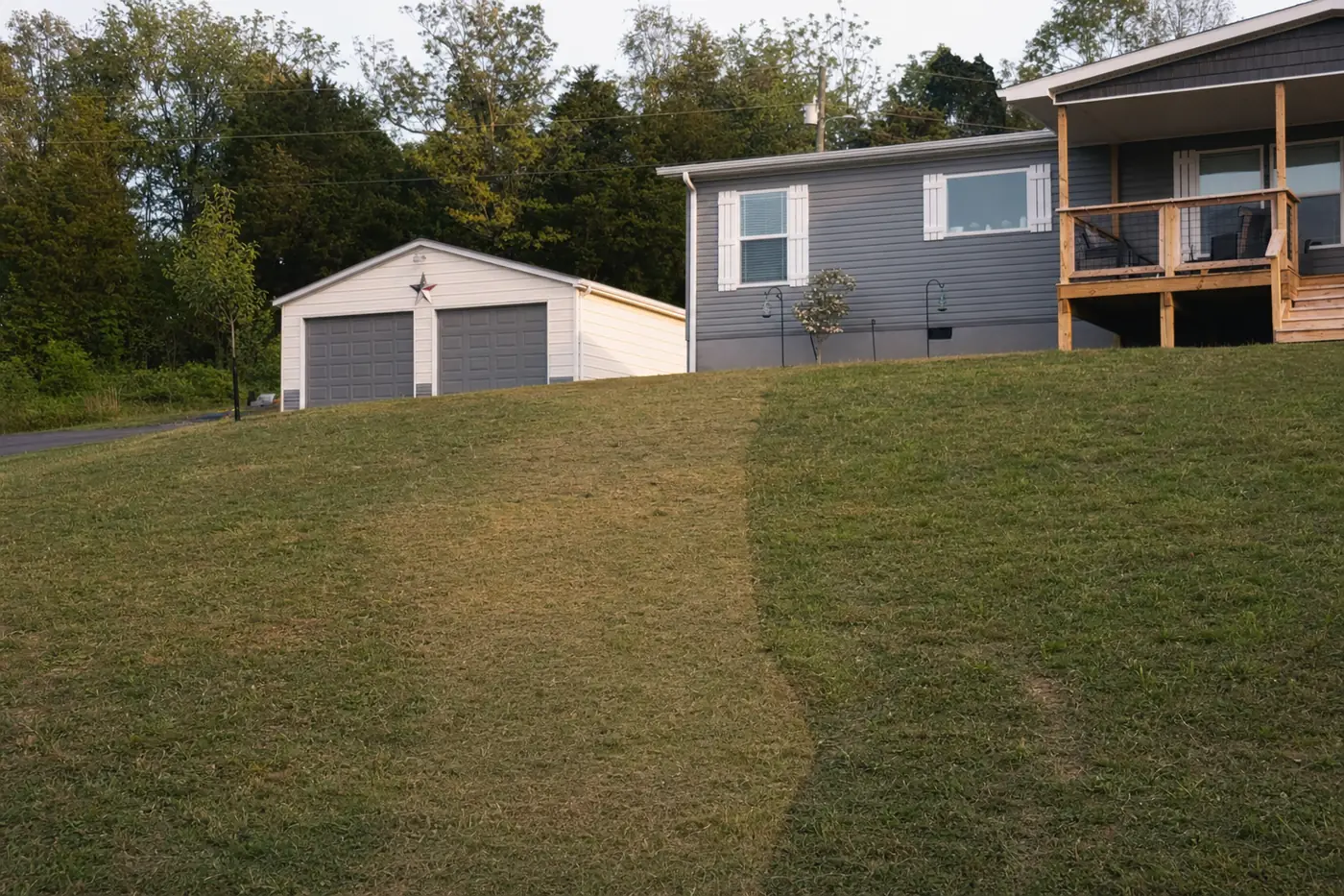 lawn-drainage-cleaning Restored lawn over a completed French drain installation